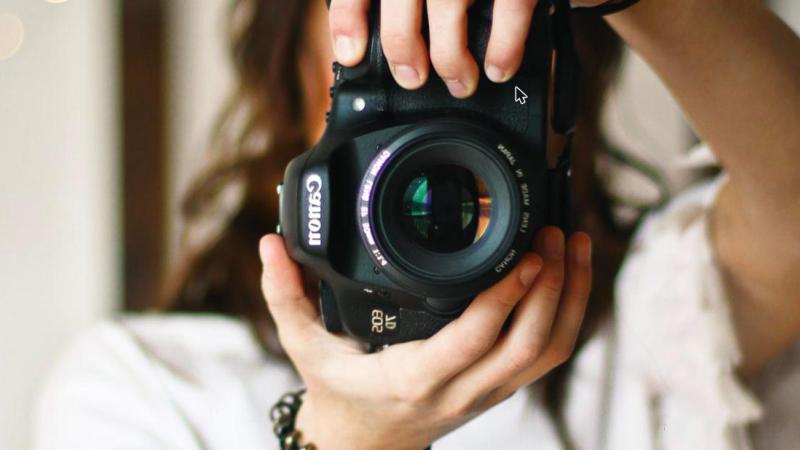 Photographer taking a picture with a camera