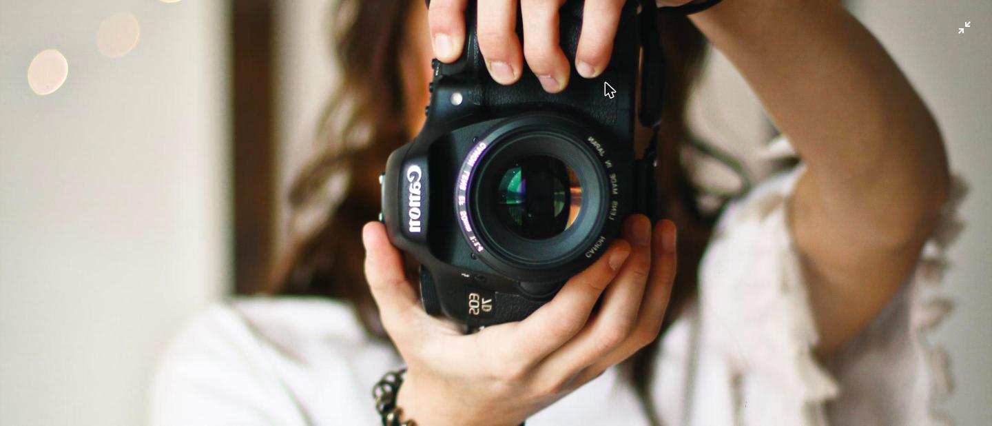 Photographer taking a picture with a camera